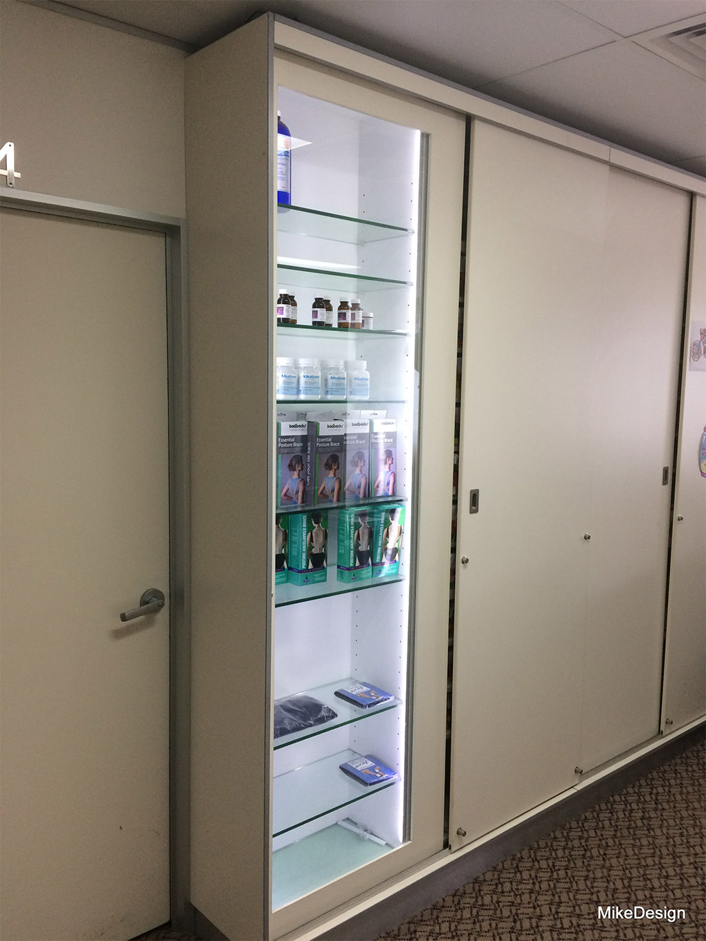 Display with LED light strips behind glass door Mike Design